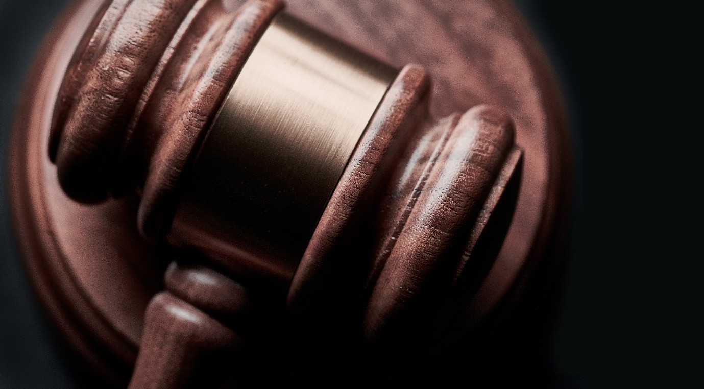 Gavel resting on documents representing service law regularization